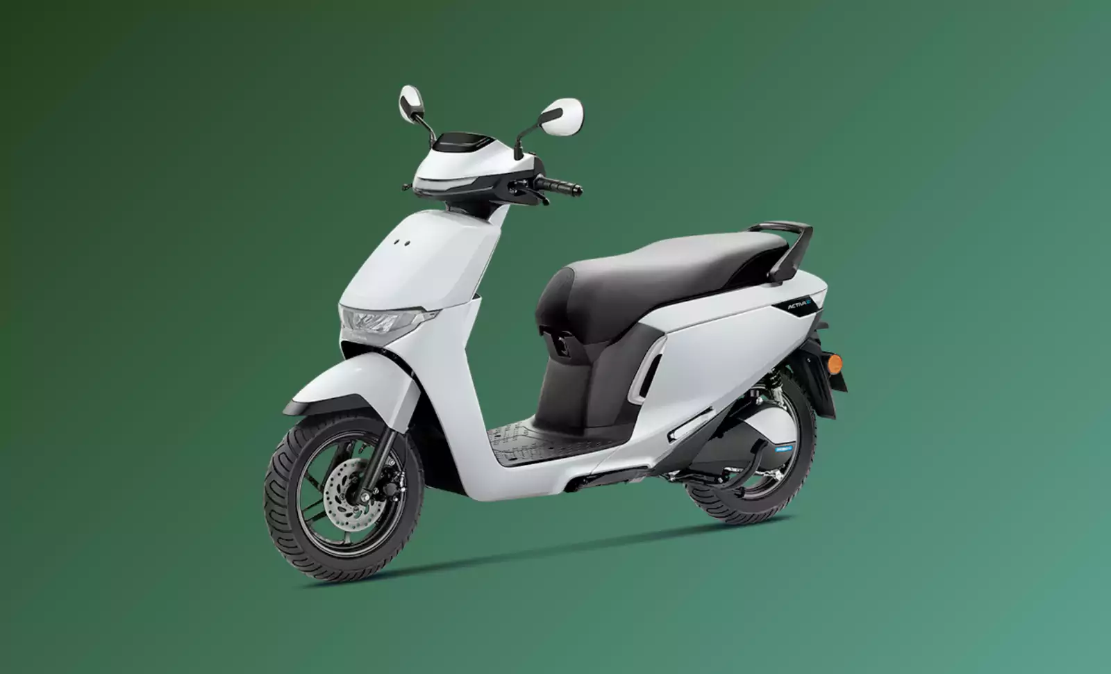 White Honda Activa e electric scooter with black seat, facing slightly to the right, against a plain green background