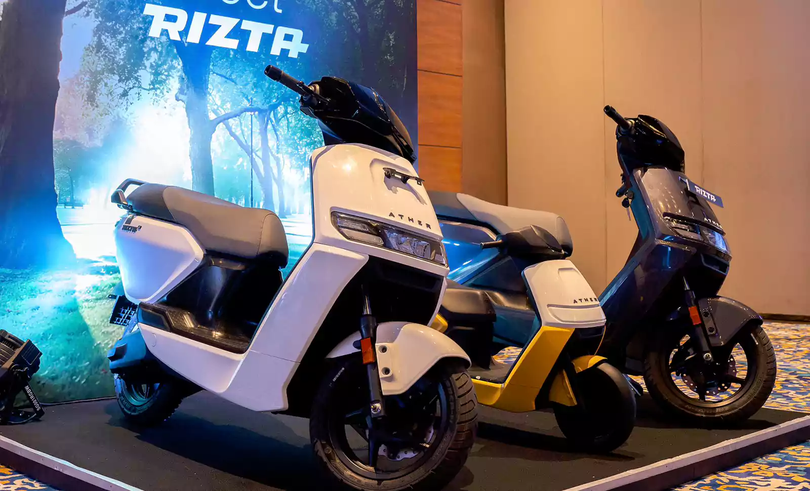 Ather Rizta electric scooters on display showcasing front view, modern design, and body colors